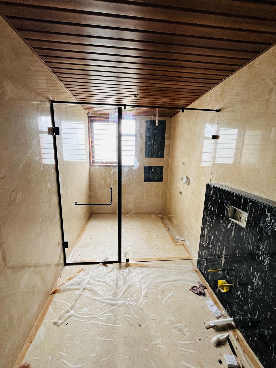 Frameless walk-in shower enclosure installed in Bengaluru apartment